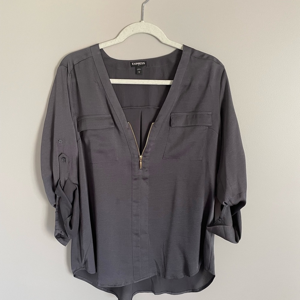 Express gray polyester shirt with front gold zipper. Size L.